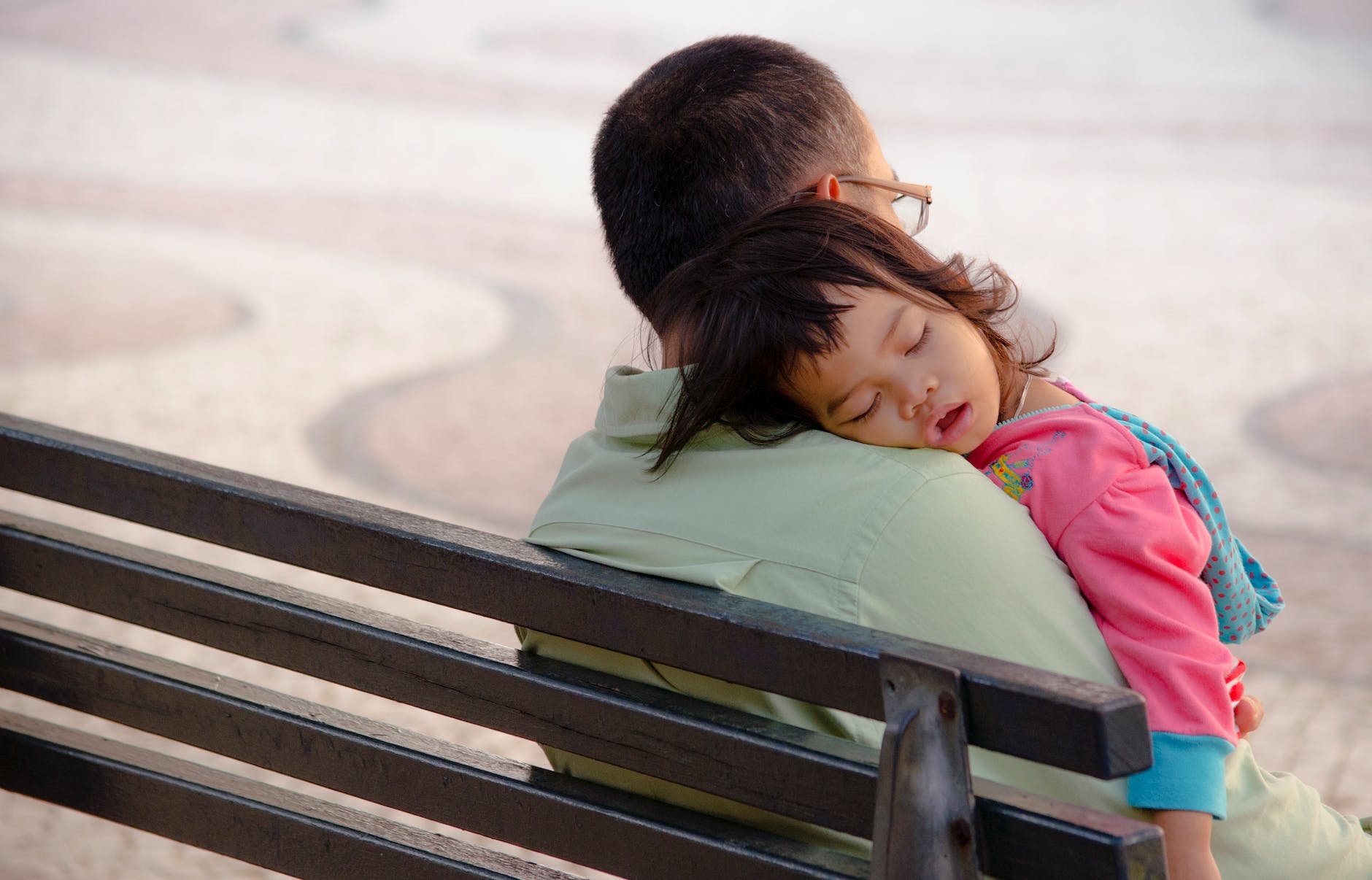 baby s sleeping on a man s shoulder